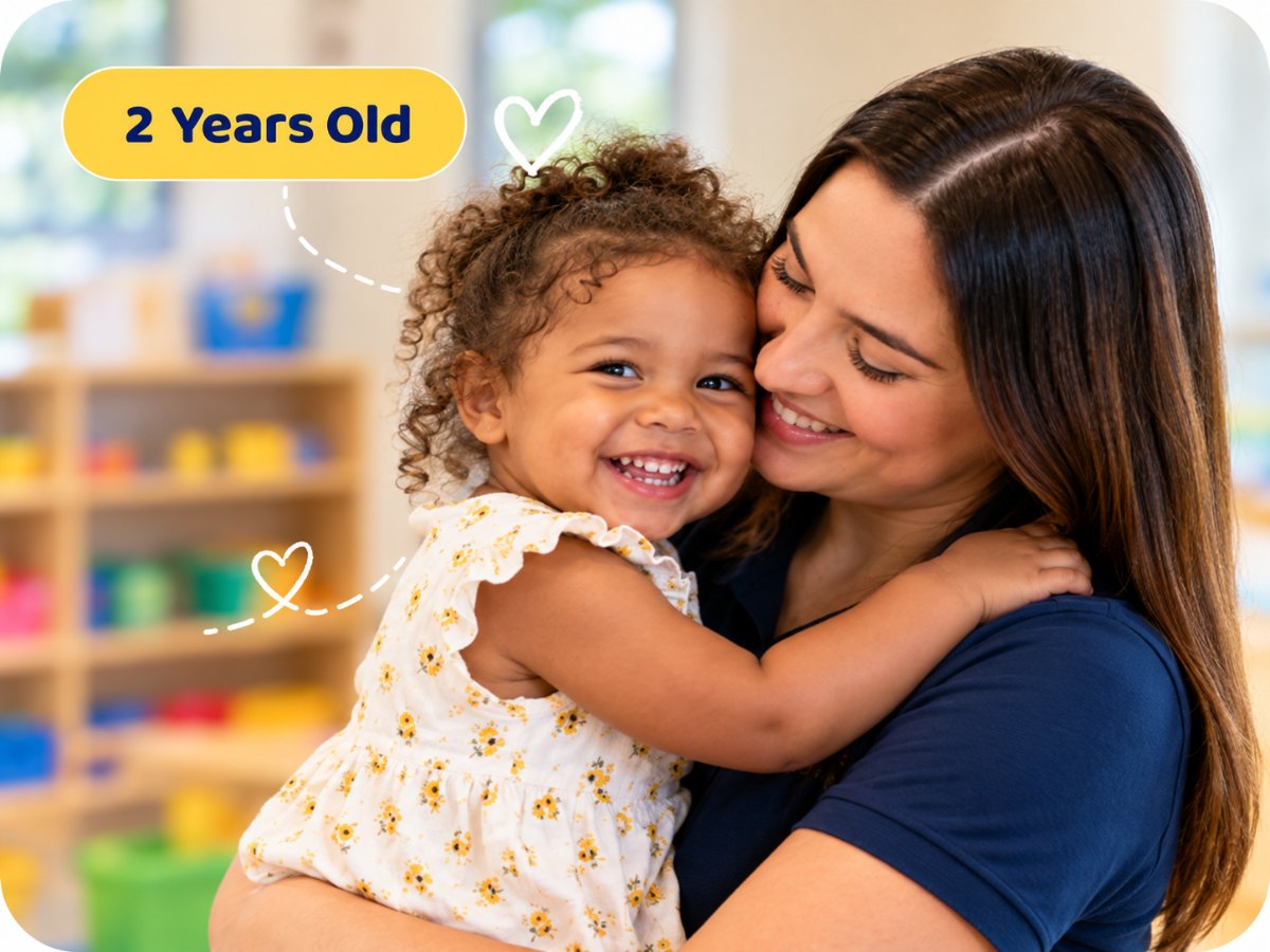 2 years old: a Family Affair teacher hugging a laughing child